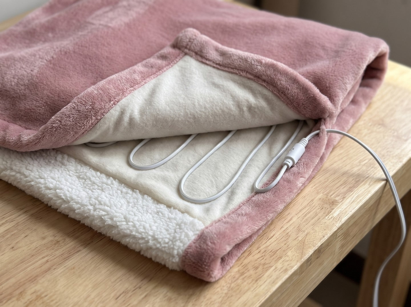 Inside Heatie: the thin, flexible heating wire between the flannel and the sherpa
